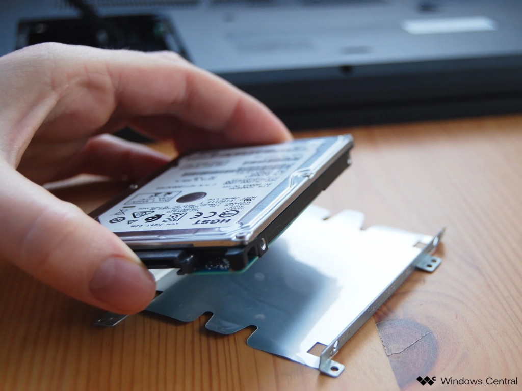  Turn the laptop over and find the panel that closes the hard drive access, its location depends on the case you have chosen because this element is individually located for each laptop (example on the photo). Open the hard drive using a screwdriver. Step 3 — Hard drive installation